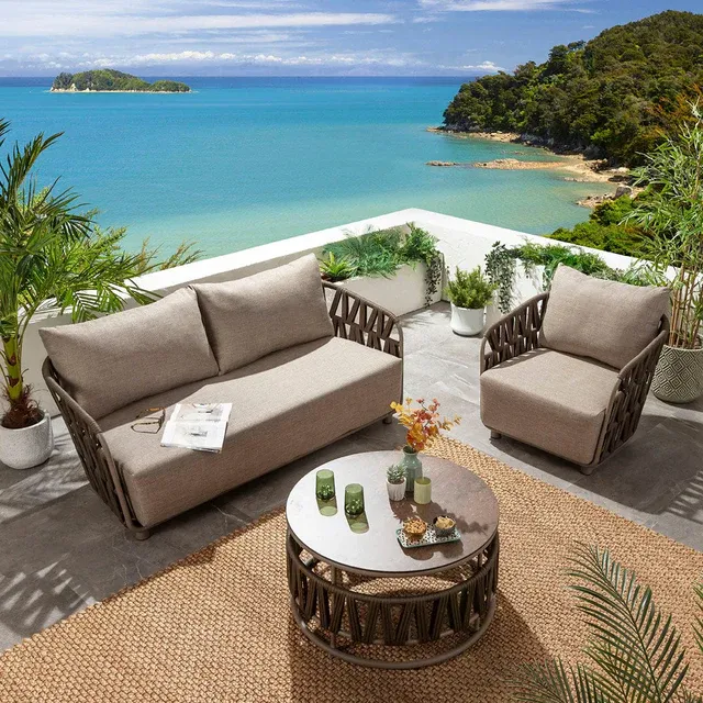 Solara outdoor sofa, armchair, and round coffee table arrangement